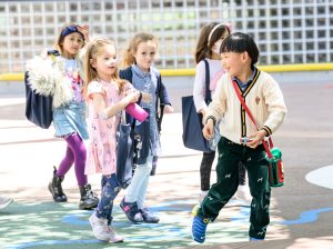 Here Nishimachi students excitedly walk to the library.